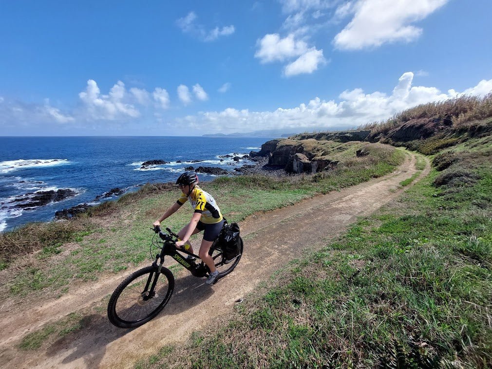 Ebike riding along a coastal gravel trail in Portugal