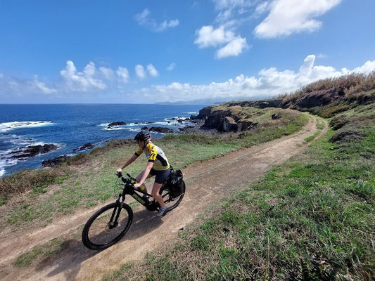 Ebike riding along a coastal gravel trail in Portugal